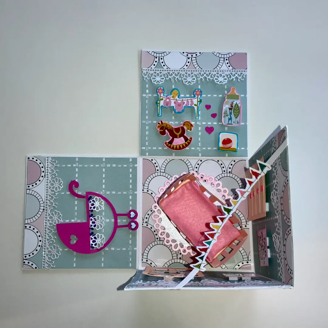 handmade new born card with intricate cuts, layers and embellishments