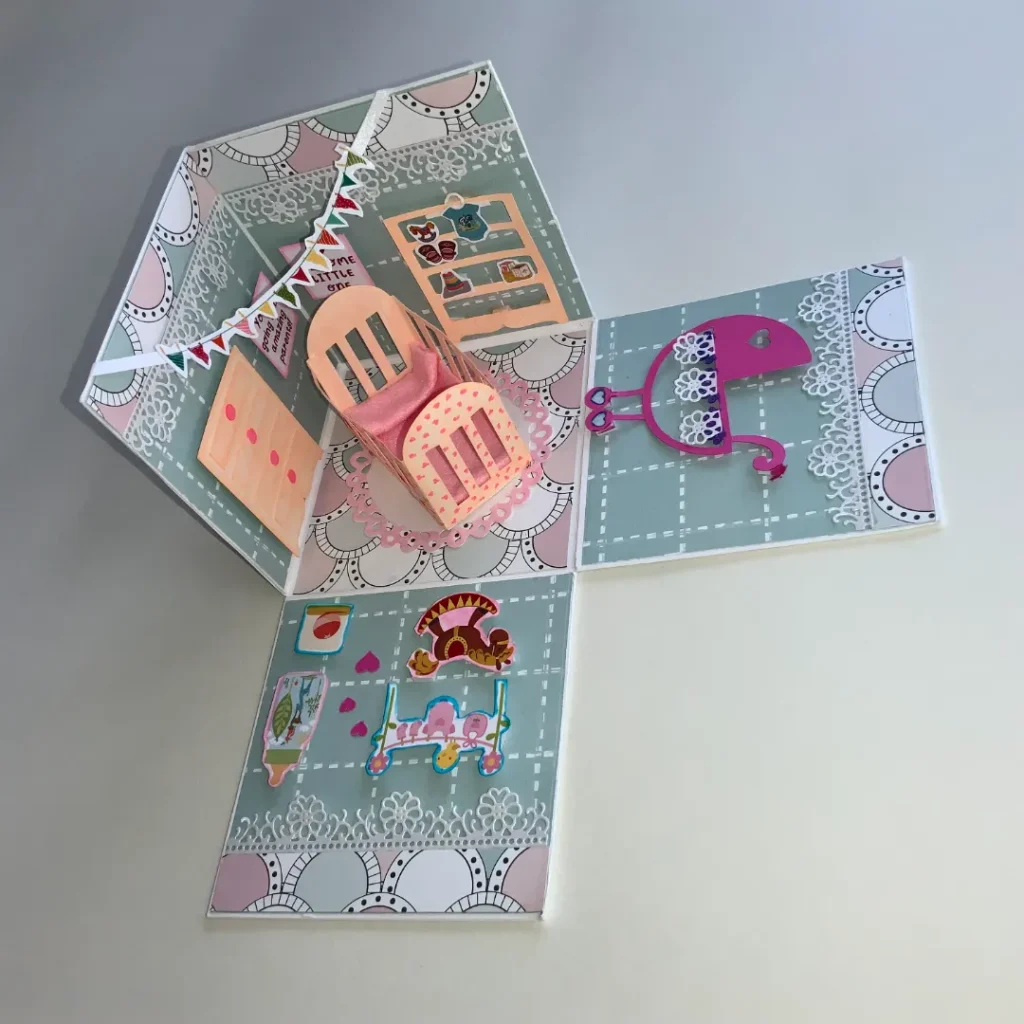 handmade new born card with intricate cuts, layers and embellishments