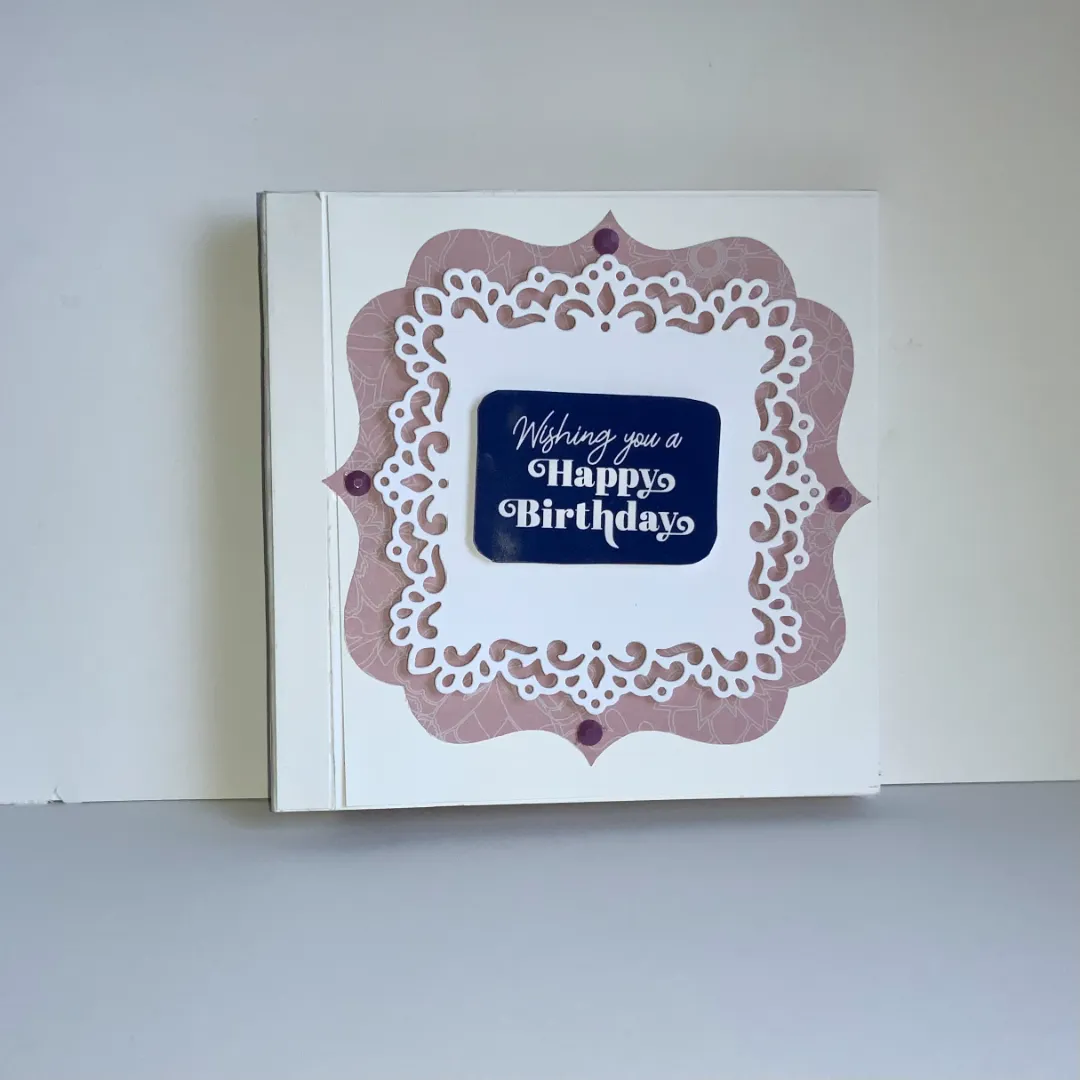 handmade birthday card with tunnel book technique and intricate cut embellishments