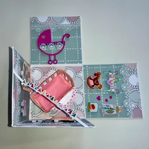 handmade new born card with intricate cuts, layers and embellishments