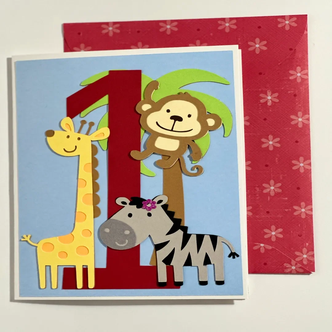 handmade birthday card to celebrate 1 year with layered zoo animals