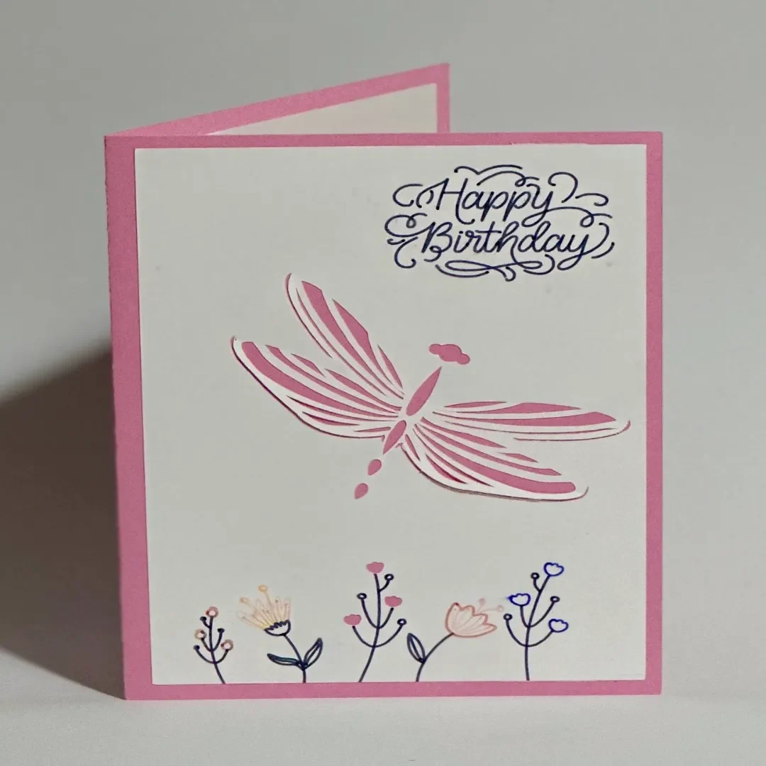 handmade birthday card with intricate cut and layered