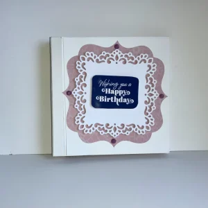 handmade birthday card with tunnel book technique and intricate cut embellishments
