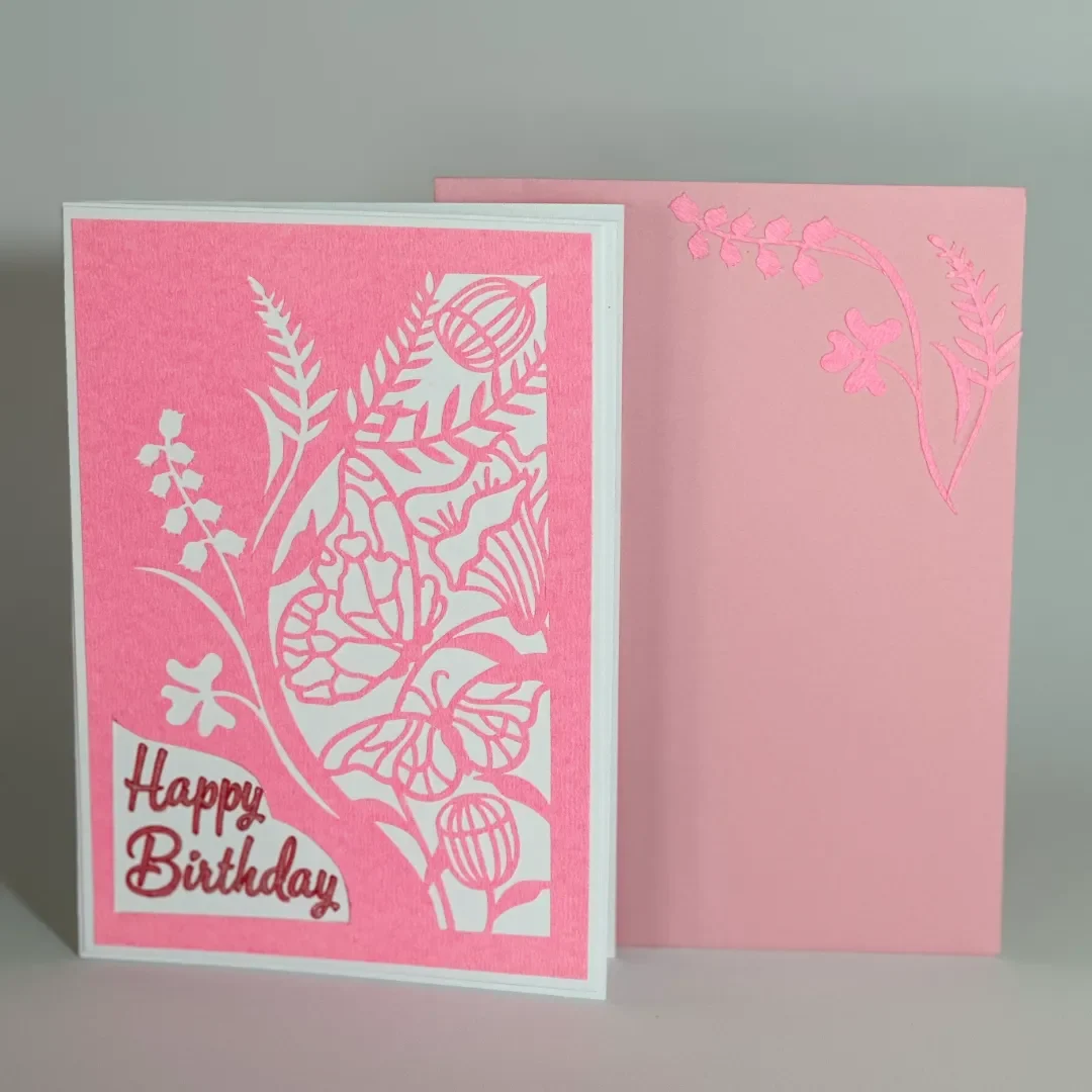 handmade birthday card with intricate cut butterfly, garden