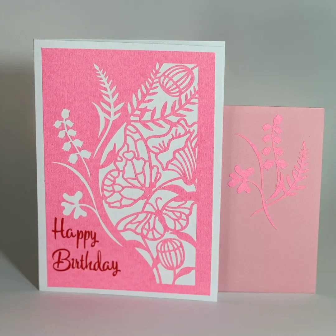 handmade birthday card with intricate cuts and designs