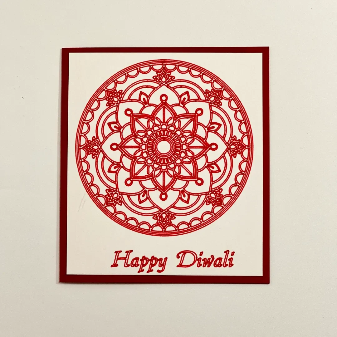 handmade diwali card with a brightly drawn mandala design