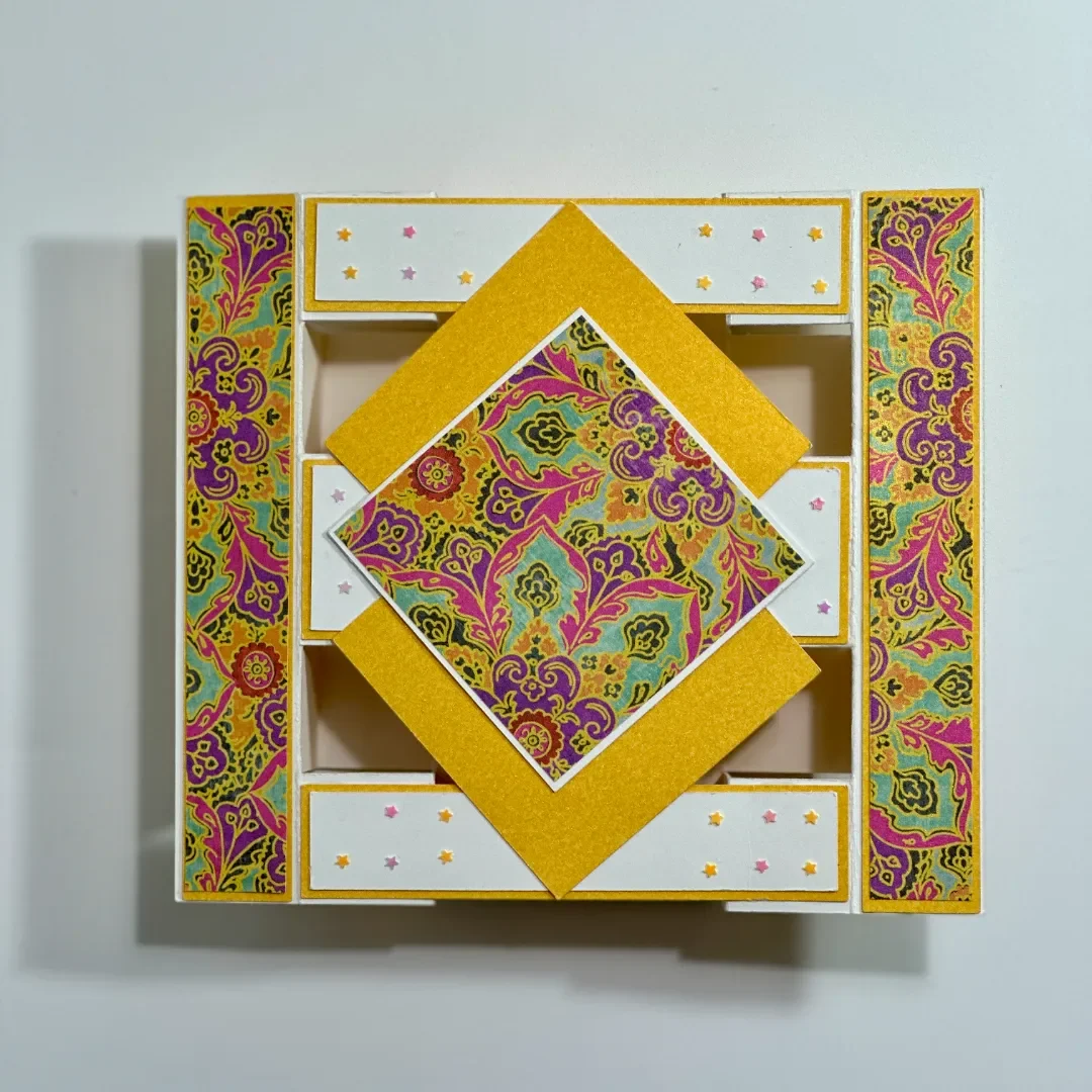 handmade diwali card in a fancy fold diamond tower card with multiple layers of patterned card and embellishments